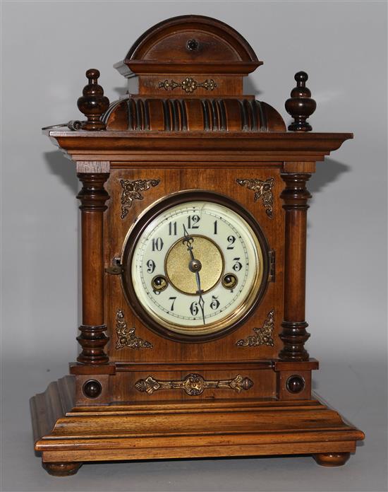 A late Victorian walnut eight day mantel clock